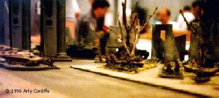 A low angle shot of the same turn. The Red Army squad in the park are in cover in the green areas. But, in order to "rush" to the next piece of cover, they must first expose themselves to the withering German fire.